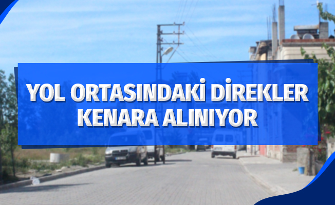 Yol ortasındaki direkler yol kenarına alınıyor